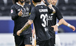 Akram Afif (left) of Al Sadd SC celebrates after scoring a goal during the Qatar Stars Lea...