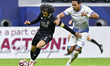 Kellian van der Kaap of Al-Sailiya SC and Akram Afif of Al Sadd SC compete during the Qata...