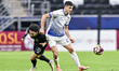 Matias Nani of Al-Sailiya SC and Akram Afif of Al Sadd SC compete during the Qatar Stars L...
