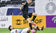 Hadi Ali Tabasideh of Al-Sailiya SC and Rafa Mujica of Al Sadd SC compete during the Qatar...
