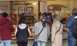Customers queue at a butcher market stall in Speyer, Rhineland-Palatinate, Germany, on Apr...