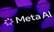 The new Meta AI logo is displayed on a smartphone screen placed on a reflective surface on...
