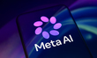 The new Meta AI logo is displayed on a smartphone screen placed on a reflective surface on...