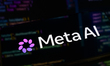 The new Meta AI logo is displayed on a smartphone screen placed on a reflective surface on...