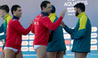 Australia and Malta national water polo team players exchange high-fives ahead of the Worl...