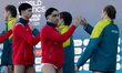 Australia and Malta national water polo team players exchange high-fives ahead of the Worl...