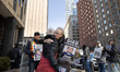 Protesters from Rise and Resist and their supporters hold a weekly vigil outside the Jacob...