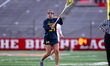 Caroline Byrd of the Michigan Wolverines passes the ball during an NCAA women's lacrosse g...