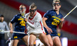 Francesca Urtis of the Rutgers Scarlet Knights retrieves a ground ball as Ava Class of the...