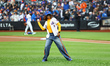 TV host Gayle King throws out the ceremonial first pitch before the baseball game between...
