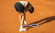 Rodrigo Pacheco throws his racket during the men's singles round of 16 at the ATP Challeng...