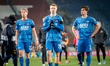 Billy van Duijl, Kees Smit, and Wouter Goes appear dejected at the end of the game between...