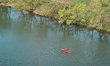 A kayaker paddles on the Neckar River in Bad Wimpfen, Baden-Wuerttemberg, Germany, on Apri...