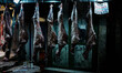 Lamb carcasses hang on display at a butcher stall inside the Varvakios Central Municipal M...