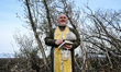 Military chaplain Father Stepan holds a prayer book and an aspergillum in the Zaporizhzhia...