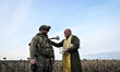 Military chaplain Father Stepan blesses a soldier before a combat mission in the Zaporizhz...