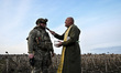 Military chaplain Father Stepan blesses a soldier before a combat mission in the Zaporizhz...