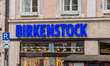 A Birkenstock store is seen in Munich, Bavaria, Germany, on April 10, 2026. People pass by...
