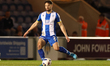 Rob Hunt of Colchester United with the ball during the Sky Bet League 2 match between Colc...