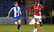Harvey Araujo of Colchester United chases Junior Hoilett of Swindon Town during the Sky Be...