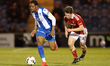 Jade Williams of Colchester United dribbles past Joel McGregor of Swindon Town during the...