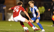 Fletcher Holman of Swindon Town pressures Fin Back of Colchester United during the Sky Bet...