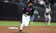 New York Mets player Francisco Lindor #12 advances to third base during the sixth inning o...