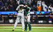 Athletics relief pitcher Elvis Alvarado #37 and catcher Shea Langeliers #23 celebrate the...
