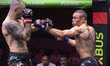 Serbian fighter Dusan Radovic (left) competes against Portuguese fighter Rafael Hudson (ri...