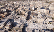 An aerial view shows the destruction of homes caused by the powerful earthquake in Aleppo,...
