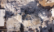An aerial view shows the destruction of homes caused by the powerful earthquake in Aleppo,...