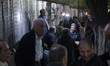 Iranian men gather at a small local park in downtown Tehran, Iran, on April 11, 2026, amid...