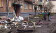 Residents in Sumy, Ukraine, observe damage to a residential building following a Russian d...