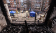 A burnt-out window in a residential building in the city of Sumy, Ukraine, following a str...