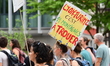 People demonstrate with a sign in Chambery, France, against the SNCF Lyon-Turin railway pr...