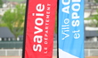 A sponsor poster for the department of Savoie and the city of Aix les Bains is displayed d...