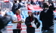Toronto FC in-game host Melissa Clausner (right) interacts with fans during a halftime sho...