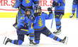 Emma Maltais (#27), left, and Maggie Connors (#22) interact with fans in the stands during...