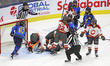 Officials intervene during a scuffle in front of the net during a Professional Women's Hoc...
