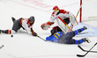 Players compete for the puck in front of goaltender Gwyneth Philips (#33) during a Profess...