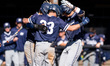 The Monmouth Hawks celebrate a home run during an NCAA baseball game at Clarke Field in Pr...
