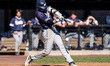 Chris Walsh of the Monmouth Hawks hits the ball during an NCAA baseball game at Clarke Fie...