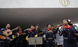 A mariachi band accompanies members of the Iranian community and various social organizati...