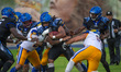 Gallos Negros running back Lee-Parker Chancellor D #6 carries the ball during the match be...