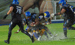 Gallos Negros running back Lee-Parker Chancellor D #6 runs the ball during the match betwe...