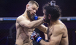 Serbian fighter Nemanja Todorovic (left) competes against German fighter Mert Ozyildirim (...