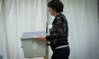 An election official carries a box with ballots in Budapest, Hungary on 12 April, 2026. 