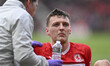 Dael Fry of Middlesbrough receives treatment after a clash of heads during the Sky Bet Cha...
