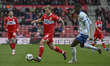 Riley McGree of Middlesbrough under pressure from Madiodio Dia of Portsmouth during the Sk...