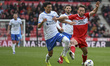 Aidan Morris of Middlesbrough competes for the ball with Andre Dozzell of Portsmouth durin...